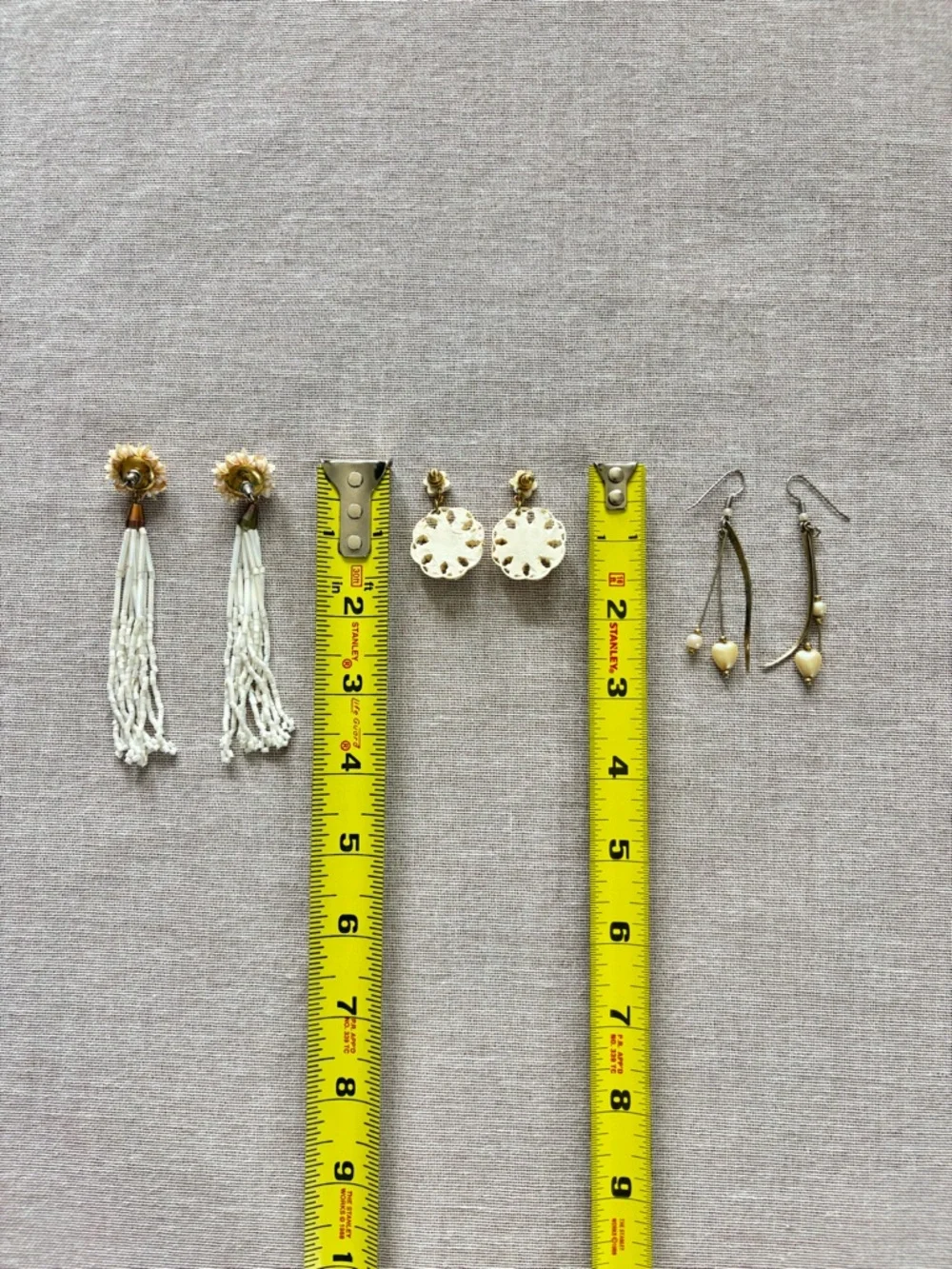 Set of three vintage cream earrings.